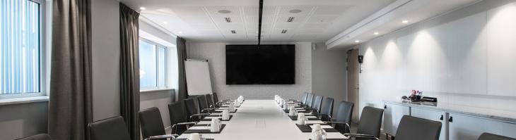 A long conference table in a meeting room