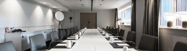A long conference table in a meeting room